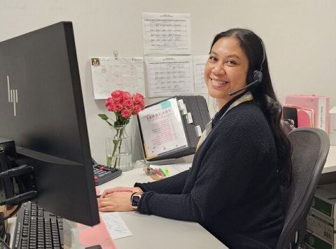 Woman smiling with a headset on